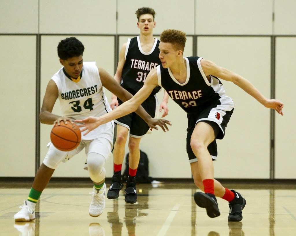 Mountlake Terrace&rsquo;s Khyree Armstead (right) goes in for a steal attempt as Shorecrest&rsquo;s Michael Mosley dribbles the ball during a game Tuesday at Shorecrest High School in Shoreline. (Ian Terry / The Herald)