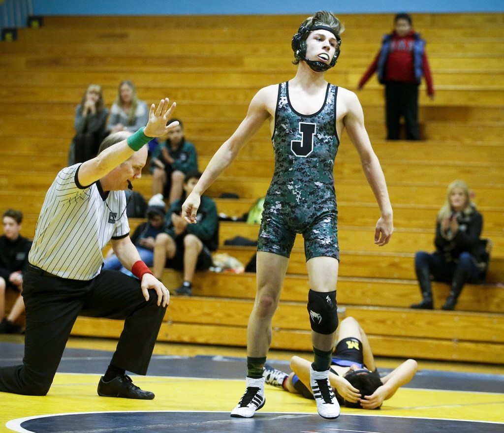 Jackson&rsquo;s Josh Vail (front) stands up after defeating Mariner&rsquo;s Julio Lopez in the 120-pound matchup at Mariner High School on Thursday, Dec. 15. (Ian Terry / The Herald)