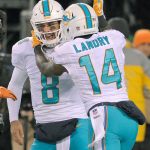 Miami&rsquo;s Jarvis Landry (14) celebrates with quarterback Matt Moore (8) after the pair connected on a long touchdown pass in the Dolphins&rsquo; 34-13 win over the New York Jets on Saturday in East Rutherford, N.J. (AP Photo/Bill Kostroun)