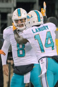 Moore sparkles as Dolphins thump Jets 34-13