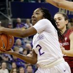 Washington&rsquo;s Aarion McDonald drives past Washington State&rsquo;s Pinelopi Pavlopoulou during the first half of Tuesday&rsquo;s game in Seattle. (AP Photo/Elaine Thompson)