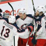 The Columbus Blue Jackets celebrate after defeating the Minnesota Wild 4-2 for their 15th straight victory on Saturday in St. Paul, Minn. (AP Photo/Andy Clayton-King)