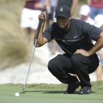 Tiger Woods lines up a putt on the first hole during the first round at the Hero World Challenge on Thursday in Nassau, Bahamas. (AP Photo/Lynne Sladky)