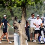 Anne-Lise Caudal of France studies her shot next to her caddie, Maximilian Zechmann (far right), on the 10th hole during the first round of Dubai Ladies Masters golf tournament Wednesday in Dubai, United Arab Emirates. Zechmann, 56, collapsed three holes later. (AP Photo/Kamran Jebreili)