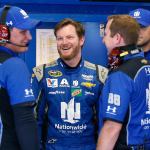 In this June 30, 2016, photo, Dale Earnhardt Jr. (second from left) chats with his crew in the garage during NASCAR Sprint Cup practice at Daytona International Speedway, in Daytona Beach, Florida. (AP Photo/Wilfredo Lee, File)