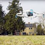 An Amazon drone delivers a package for the first time by air, in England. The company says this video documented the actual event. (Amazon via YouTube)