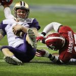 Alabama defensive back Ronnie Harrison tackles Washington quarterback Jake Browning on a quarterback keeper during the second quarter of the Peach Bowl on Saturday in Atlanta. (Curtis Compton/Atlanta Journal-Constitution)