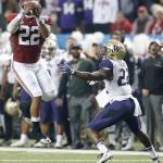 Alabama linebacker Ryan Anderson (22) picks off a pass intended for Washington running back Lavon Coleman (22) during the first half of the Peach Bowl on Saturday in Atlanta. Anderson returned the interception for an Alabama touchdown. (AP Photo/Skip Martin)