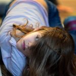 Eva Katsilometes twists her self around to view another angle of an optical illusion during the &ldquo;I Can&rsquo;t Believe My Eyes&rdquo; science event held at the Lynnwood Public Library on Dec. 22 in Lynnwood. The science program is part of Sno-Isle and Imagine Children&rsquo;s Museum&rsquo;s Winter Break science activities for kids. (Andy Bronson / The Herald)