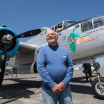 World War II pilot Bob Drew waits to take a ride in Maid in the Shade, a B-25 Mitchell bomber that flew 15 combat missions during World War II, on Aug. 1 outside the Flying Heritage Collection in Everett. Drew&rsquo;s voice will be part of the audio collection Chronicles of Courage: Stories of Wartime and Innovation available online through the museum. (Andy Bronson / The Herald)