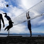 A mid-winter volleyball game breaks out at Golden Gardens Park on Ballard&rsquo;s waterfront in Seattle on Thursday, Dec. 8. (Ian Terry / The Herald)