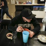 A visitor to Cocoon House&rsquo;s U-Turn drop-in center on Broadway in Everett eats a warm meal on Tuesday, Dec. 13. The nonprofit that provides shelter and other services to at-risk youth is planning a major expansion and is slated to move into a new building on Colby Avenue by mid-2018. (Ian Terry / The Herald)