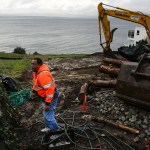 City of Edmonds worker Vince Smith stands on a property being developed on a hillside along 75th Place West in Edmonds on Friday. (Ian Terry / The Herald)