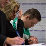 Tye Fleischer bows his head during his sentencing at the Snohomish County Court in Everett on Monday. Fleischer was sentenced to life in prison without parole after murdering two and injuring one last year. (Daniella Beccaria /The Herald)