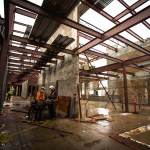 Construction crews work in what will be the main hallway of the two-story building filled with classrooms at Park Place Middle School on Monday in Monroe. The project is currently in its first phase and is set to be completed by 2018 with reconstruction of classrooms, fields, administration office, gymnasium and cafeteria. (Daniella Beccaria / The Herald)