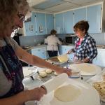 The potato balls are rolled out using a patterned rolling pin with a floured sock on it, then fried on a griddle. (Andy Bronson / The Herald)