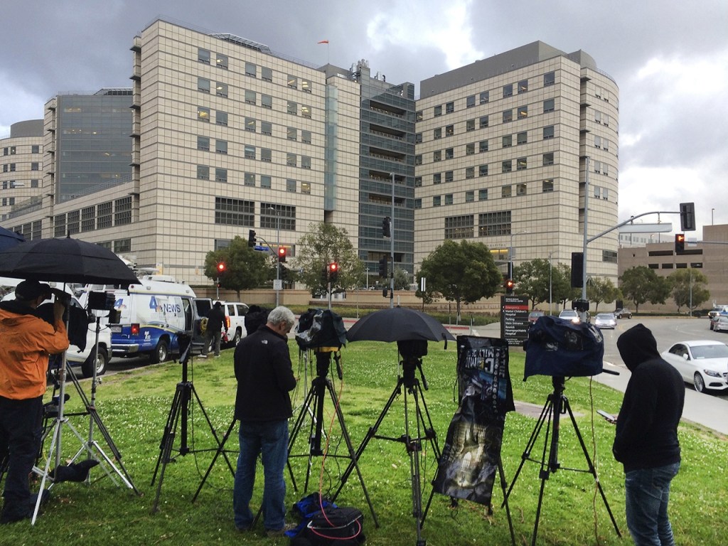 A large gathering of media personnel camp outside the Ronald Reagan UCLA Medical Center in Los Angeles, on Friday, Dec. 23, where TMZ and the Los Angeles Times reported actress Carrie Fisher had been taken after suffering a medical emergency on a flight from London to Los Angeles. (AP Photo/Rick Taber)