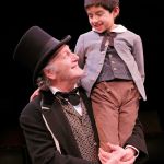 Frank Corrado (Ebenezer Scrooge) and Keagan Estes (Tiny Tim) star in ACT Theatre&rsquo;s &ldquo;A Christmas Carol,&rdquo; playing through Dec. 28 in Seattle. (Chris Bennion photo)