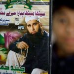 In this Dec. 3, 2014 photo, a vendor shows a DVD of Pakistan&rsquo;s Junaid Jamshed at a stall in Islamabad, Pakistan. (AP Photo/B.K. Bangash, File).