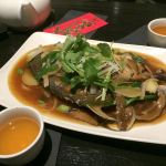 Journeys East&rsquo;s traditional fried fish for the new year&rsquo;s celebration comes complete with head and tail. (Gale Fiege / The Herald)