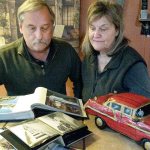 Lynnwood&rsquo;s Ed and Judy Rekola look over photos and items brought back from Cuba, where they have spent time as visitors to a church in Matanzas, about 50 miles east of Havana. (Julie Muhlstein / The Herald)