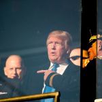 President-elect Donald Trump speaks with members of the military in a box in the stands at the Army-Navy college football game Saturday in Baltimore. (AP Photo/Andrew Harnik)