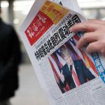 A man at a news stand in Beijing reads a newspaper on Nov. 10 with the headline of &ldquo;U.S. President-elect Donald Trump delivers a mighty shock to America.&rdquo; (AP Photo/Andy Wong)