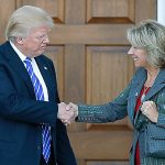 President-elect Donald Trump and Betsy DeVos shake hands at Trump National Golf Club Bedminster clubhouse in Bedminster, New Jersey, on Saturday, Nov. 19. (AP Photo/Carolyn Kaster, file)