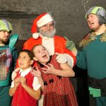 Red Curtain photo Martians Vulgar (Nick Poling, left) and Kimar (Kyle Joy, right) kidnap Santa (Alex De Roest) and the two Earth children Billy (Noah Mooring) and Betty (Quinn Mitchel) in &ldquo;Santa Claus Conquers the Martians.&rdquo;
