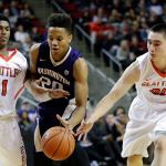Washington&rsquo;s Markelle Fultz (20) drives between Seattle&rsquo;s Morgan Means (1) and Zack Moore during the first half of a game Thursday in Seattle. (AP Photo/Elaine Thompson)