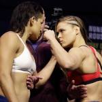 Ronda Rousey (right) and Amanda Nunes face off for photographers during an event for UFC 207 on Thursday in Las Vegas. Rousey is scheduled to fight Nunes in a mixed martial arts women&rsquo;s bantamweight championship bout Saturday in Las Vegas. (AP Photo/John Locher)