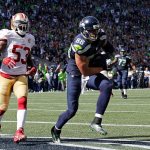 Seahawks tight end Jimmy Graham (88) scores a touchdown in front of 49ers linebacker NaVorro Bowman in the first half of a game Sept. 25 in Seattle. (AP Photo/John Froschauer)