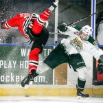 The Silvertips&rsquo; Lucas Skrumeda (right) and the Winterhawks&rsquo; Alex Schoenborn battle for the puck during a game last season at Xfinity Arena in Everett. (Kevin Clark / The Herald)