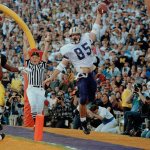 Washington&rsquo;s Mark Bruener celebrates in the end zone after catching a 6-yard touchdown pass in the third quarter of of the Rose Bowl against Michigan on Jan. 1, 1992, in Pasadena, Calif. Washington won the game 34-14. (AP Photo/Bob Galbraith)