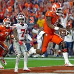 Clemson quarterback Deshaun Watson (4) runs in for a touchdown as Ohio State safety Damon Webb (7) watches during the second half of the Fiesta Bowl on Saturday in Glendale, Ariz. (AP Photo/Ross D. Franklin)