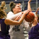 Glacier Peak&rsquo;s Kayla Watkins (center) attempts a shot with Lake Stevens&rsquo; Kristen Glick (left) and Rocky Leenstra defending Wednesday night at Glacier Peak High School in Snohomish. (Kevin Clark / The Herald)