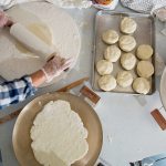 Making lefse, a traditional soft Norwegian flatbread made with potatoes, flour, butter, and milk or cream, in the kitchen at Ebenezer Lutheran Church on Tuesday, Nov. 8, in Lake Stevens. The potato balls are rolled out using a patterned rolling pin with a floured sock on it, then cooked on a griddle. (Andy Bronson / The Herald)