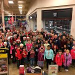 The South Everett-Mukilteo Rotary Club took 40 kids from low-income families on a shopping trip to Fred Meyer to find Christmas presents for their families, friends, teachers, and also to find a few things for themselves. (Contributed photo)
