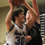 Glacier Peak&rsquo;s Bobby Martin (left) attempts a shot with Jackson&rsquo;s Hunter Johnson defending during a game Friday at Glacier Peak High School in Snohomish. The Grizzles defeated the Timberwolves 64-41. (Kevin Clark / The Herald)