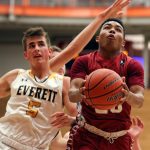 Cascade&rsquo;s D&rsquo;Andre Bryant attempts a shot with Everett&rsquo;s Byron Lewellen trailing during the annual Battle of Broadway Friday night at Everett Community College on December 2, 2016. (Kevin Clark / The Herald)