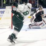 The Silvertips&rsquo; Patrick Bajkov shoots and scores a goal with the Giants&rsquo; Ryan Kubic defending in the first period Wednesday night at Xfinity Arena in Everett. (Kevin Clark / The Herald)