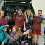 Seattle Hill Elementary School students show a car trunk stuffed with over 700 stuffed toys, bound for Christmas House. The school took first place in an Everett Elks Lodge 479 contest to see which school could donate the most stuffed toys. They received a trophy for their efforts. (Contributed photo)