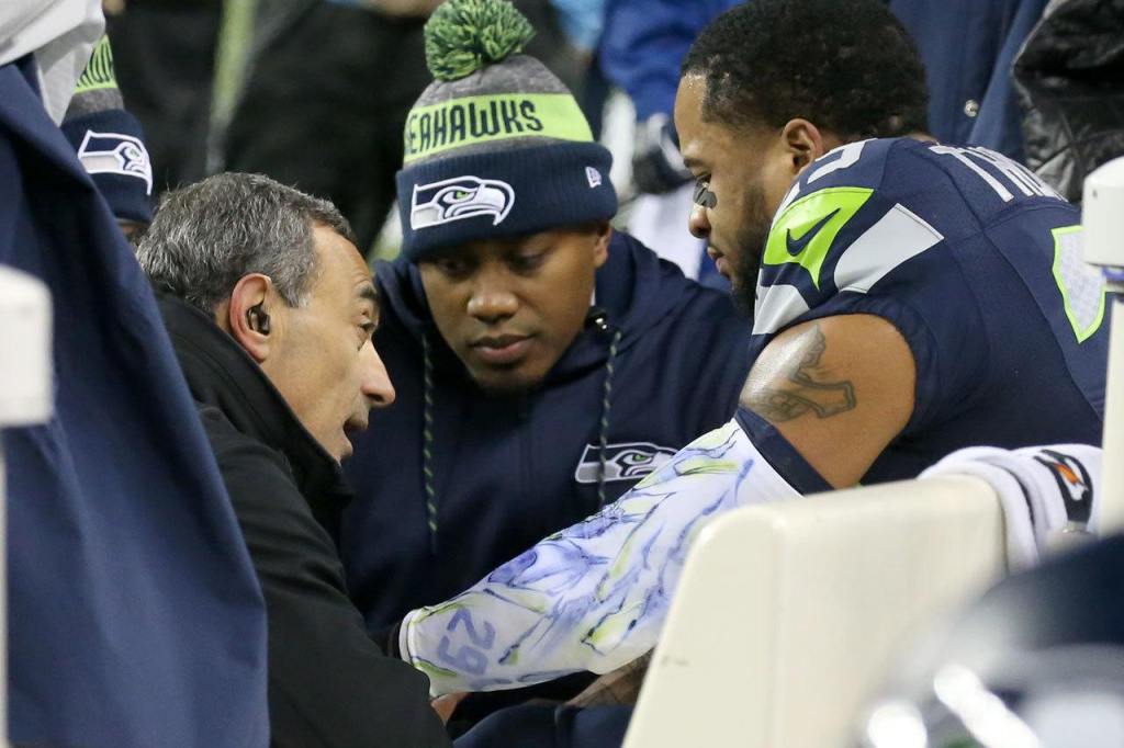 Seahawks staff examines Seahawks safety Earl Thomas Sunday night against the Panthers at CenturyLink Field in Seattle on December 4, 2016.(Kevin Clark / The Herald)