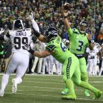 Seahawks quarterback Russell Wilson throws a touchdown to Seahawks wide receiver Doug Baldwin at CenturyLink Field Thursday night in Seattle on December 15, 2016. (Kevin Clark / The Herald)