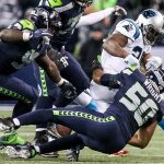 Seahawks linebacker K.J. Wright forces a fumble by Panthers running back Jonathan Stewart Sunday night at CenturyLink Field in Seattle on December 4, 2016. (Kevin Clark / The Herald)