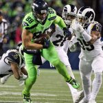 Seahawks tight end Jimmy Graham runs for additional yards with a host of Rams defenders trailing at CenturyLink Field Thursday night in Seattle on December 15, 2016. (Kevin Clark / The Herald)