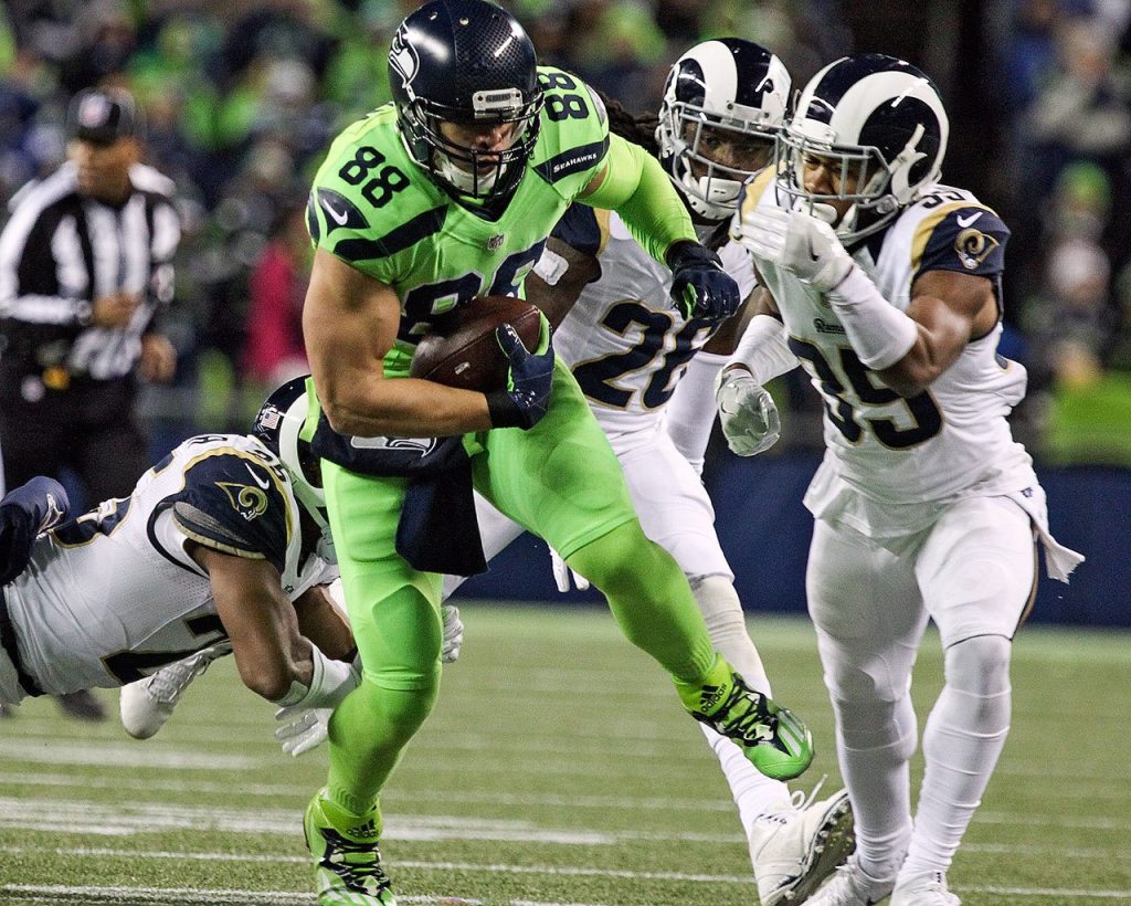 Seahawks tight end Jimmy Graham runs for additional yards with a host of Rams defenders trailing at CenturyLink Field Thursday night in Seattle on December 15, 2016. (Kevin Clark / The Herald)