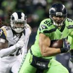Seahawks tight end Jimmy Graham runs for additional yargade with Rams safety Mark Barron trailing at CenturyLink Field Thursday night in Seattle on December 15, 2016. (Kevin Clark / The Herald)
