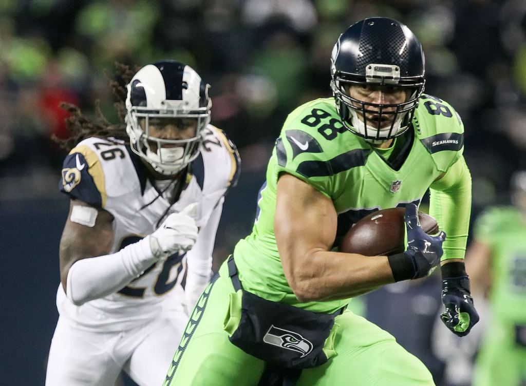 Seahawks tight end Jimmy Graham runs for additional yargade with Rams safety Mark Barron trailing at CenturyLink Field Thursday night in Seattle on December 15, 2016. (Kevin Clark / The Herald)