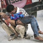 A man cries while holding the body of his son, killed by the Syrian Army, near Dar El Shifa hospital in Aleppo, Syria, on Oct. 3, 2012. (AP Photo/Manu Brabo, File)
